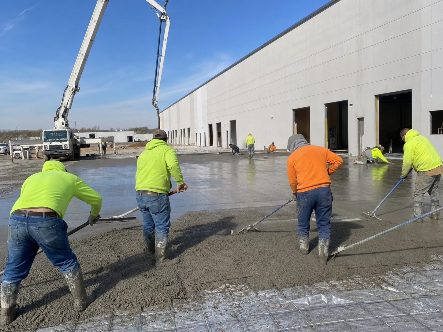Warehouse floor concrete pour in Lee's Summit area — high-PSI industrial slab finishing