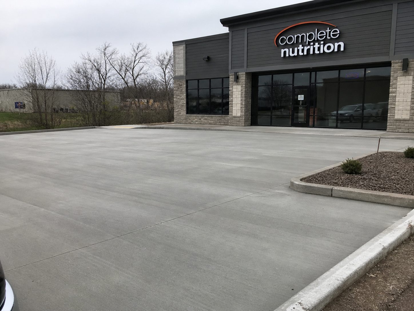 Finished commercial concrete entrance and parking approach — Lee's Summit contractor