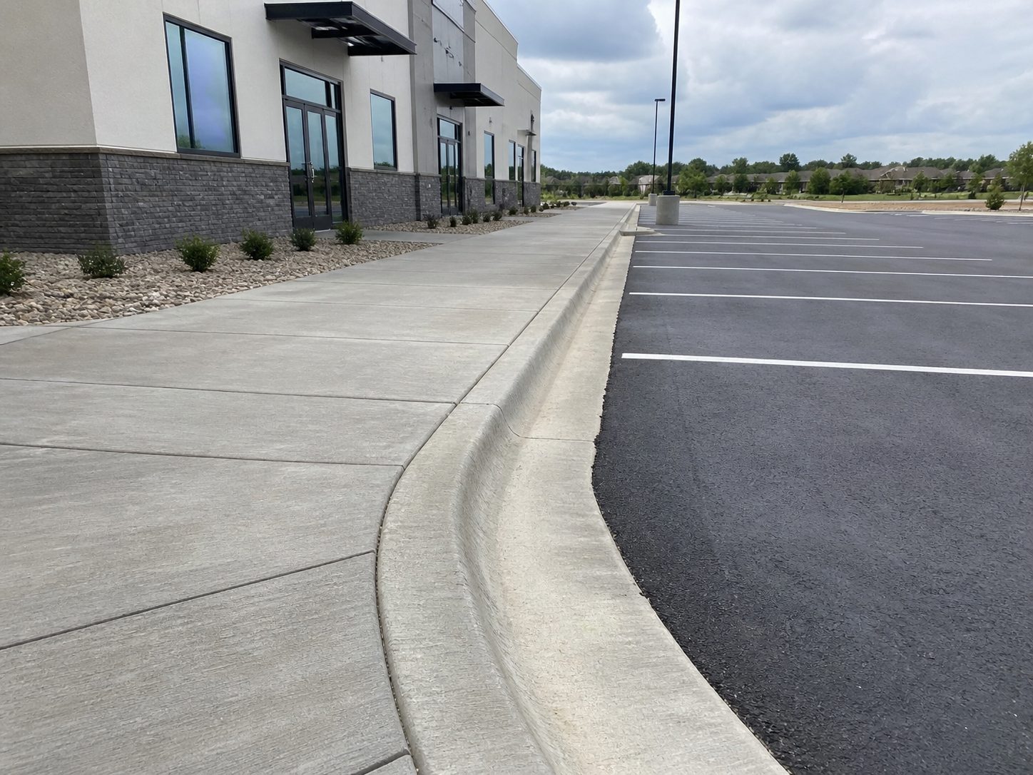 Commercial concrete driveway apron and curb cut for a KC metro business property