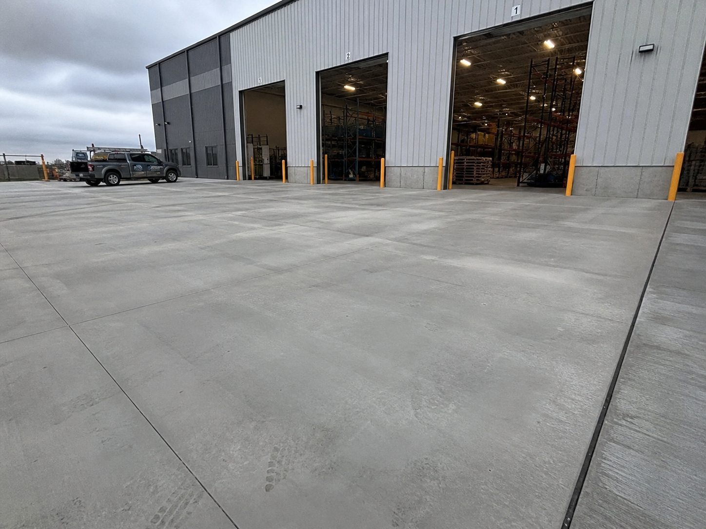 Finished warehouse exterior concrete dock area at a Lee's Summit, MO commercial facility