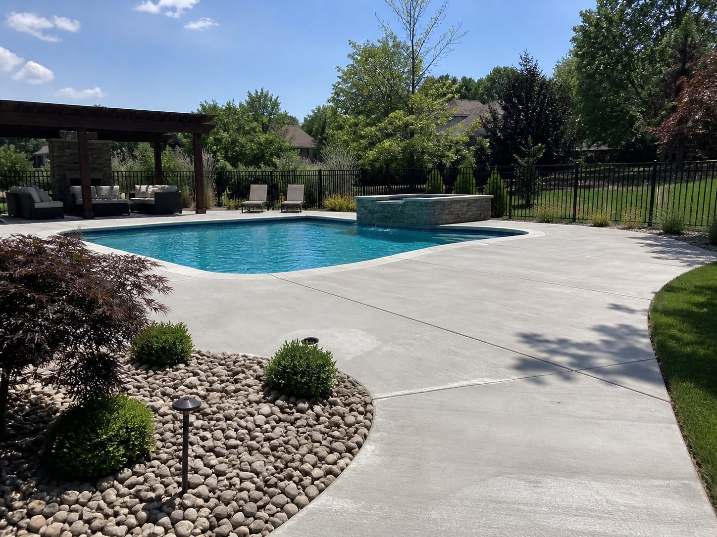 Finished pool deck and outdoor living concrete at a Raymore, MO residential property